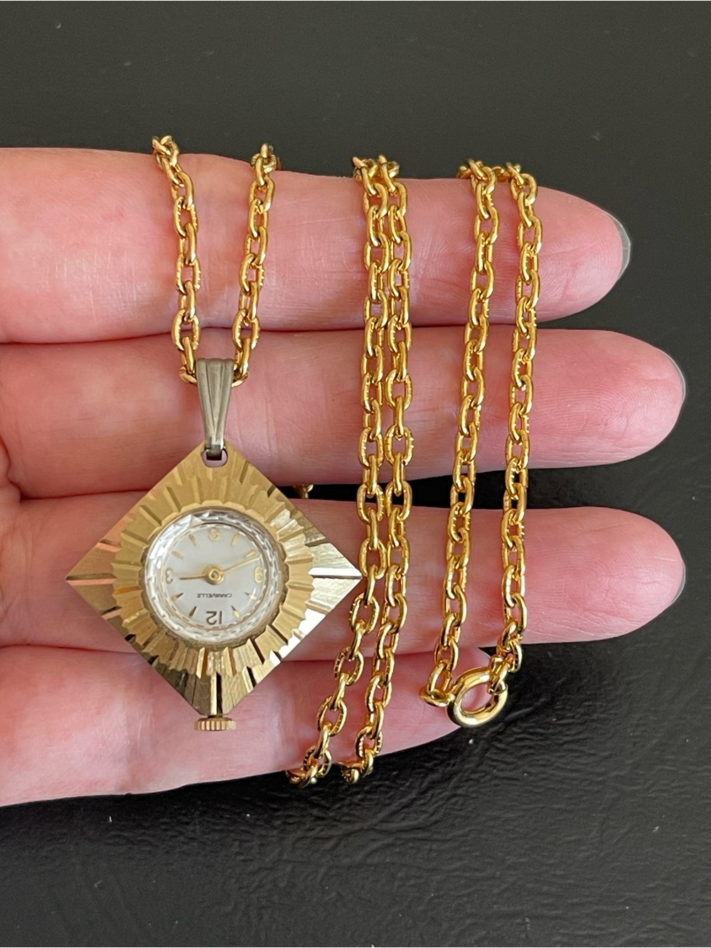 Vintage Caravelle gold tone diamond shape 7 jewel pendant watch necklace.